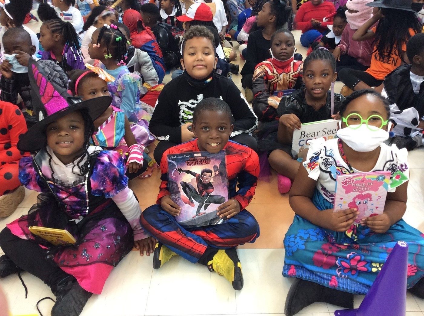 Students Dressed as Book Characters and Holding Books During a Book Character Parade