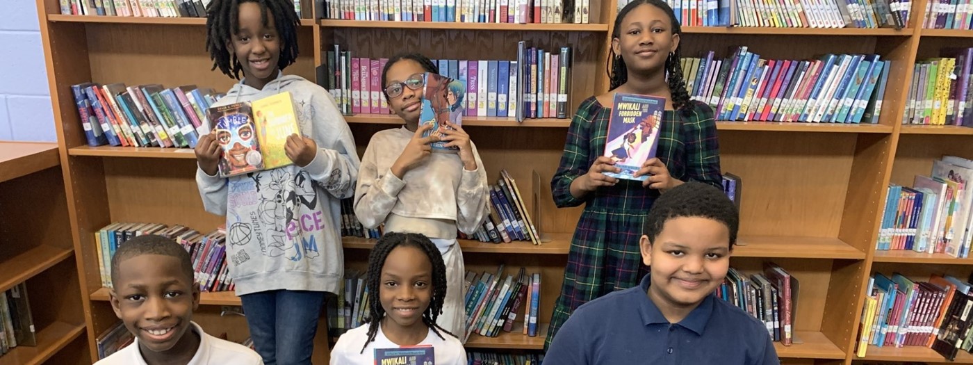 Reading Bowl Students pose with their books